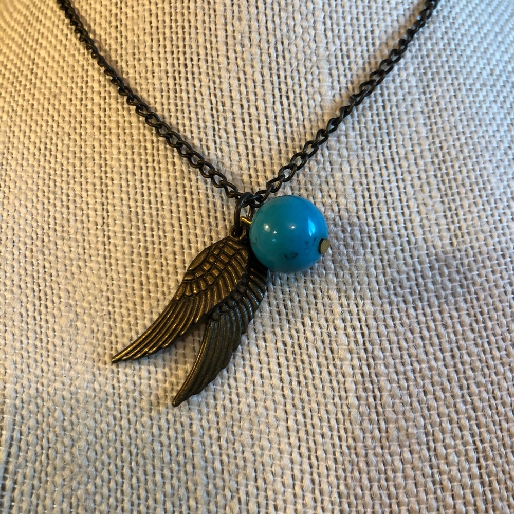 Bronze wings and turquoise colored bead necklace